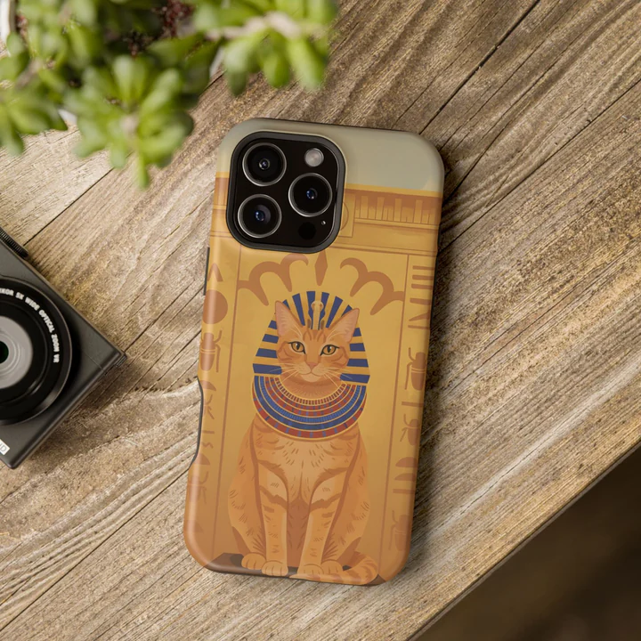 A cat's portrait on a phone case, lying on a table